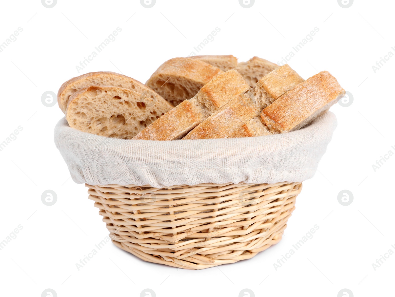 Photo of Cut delicious ciabatta in wicker basket isolated on white