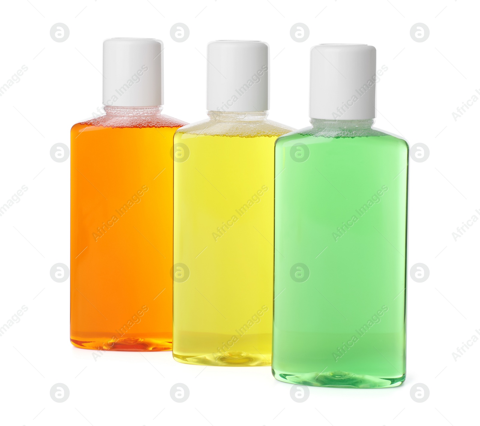 Photo of Three bottles of mouthwash isolated on white