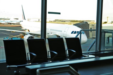 Row of seats in waiting area at airport terminal