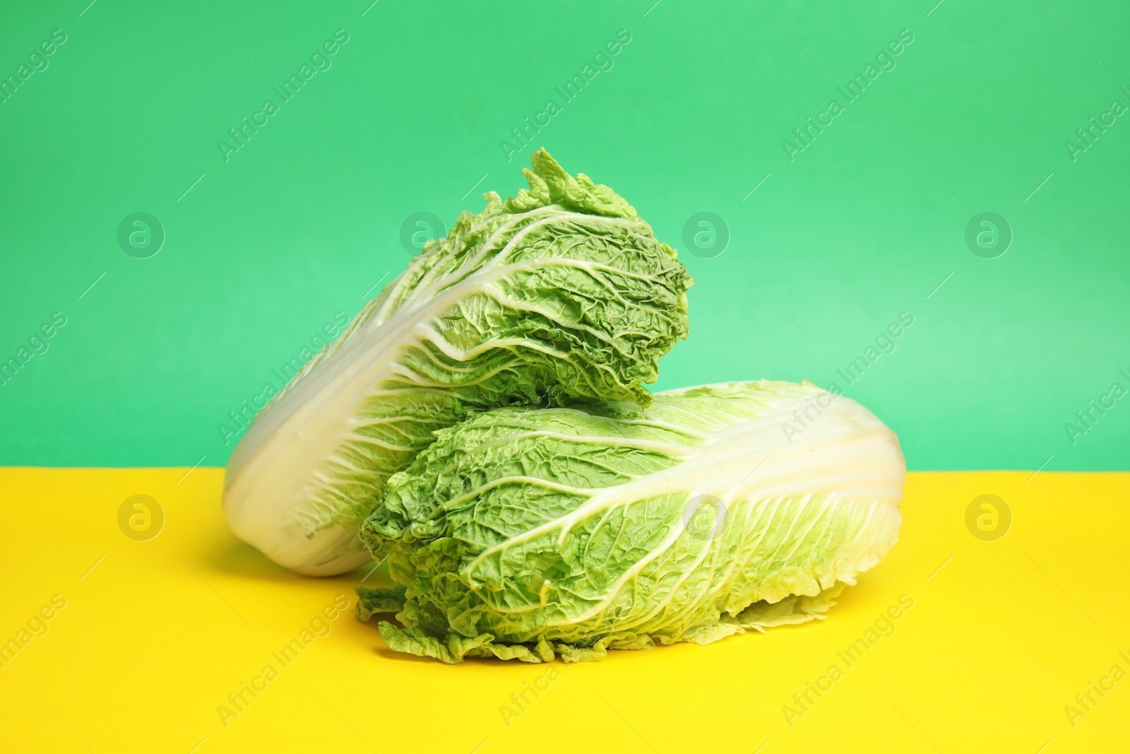 Photo of Fresh ripe cabbages on color background