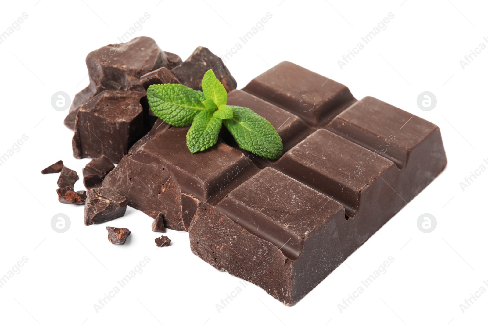 Photo of Tasty chocolate pieces and mint on white background
