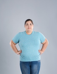 Overweight woman before weight loss on color background