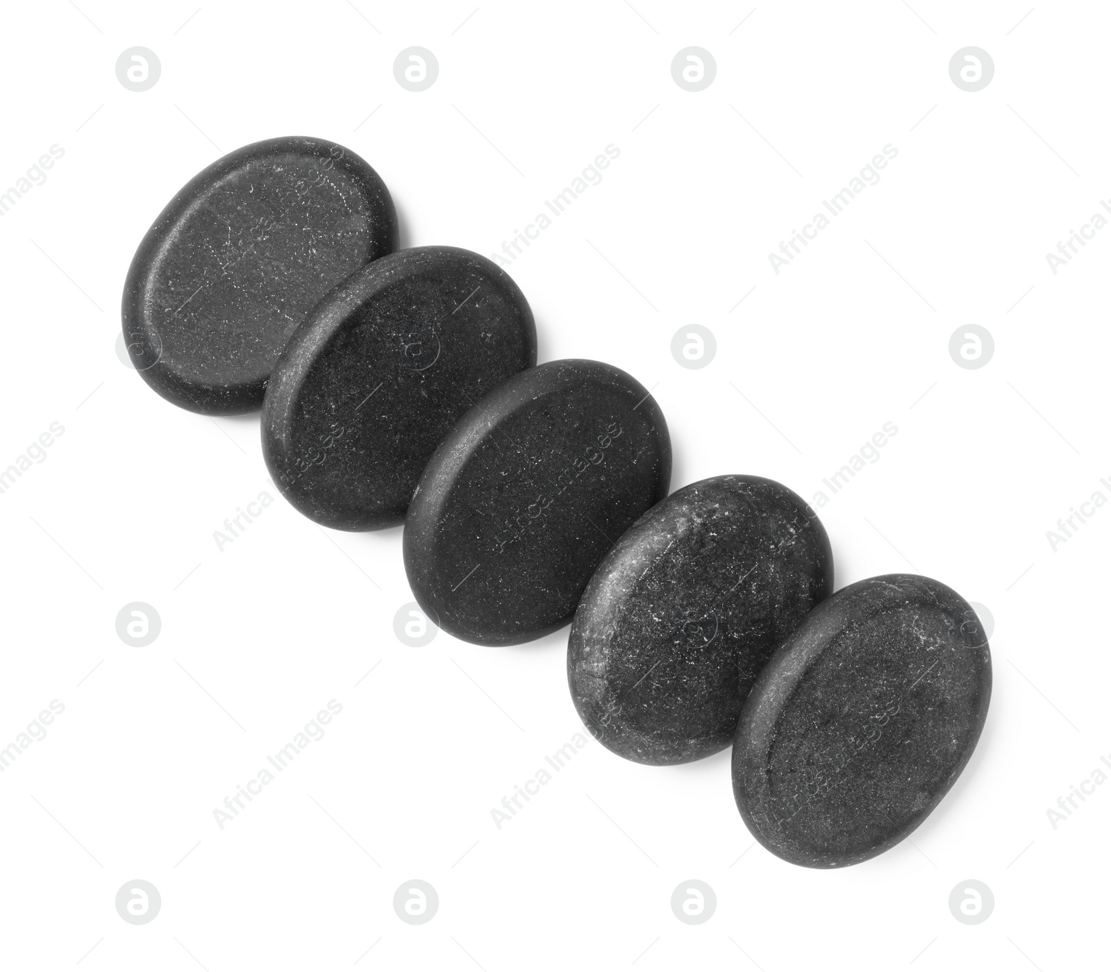 Photo of Group of black stones on white background, top view