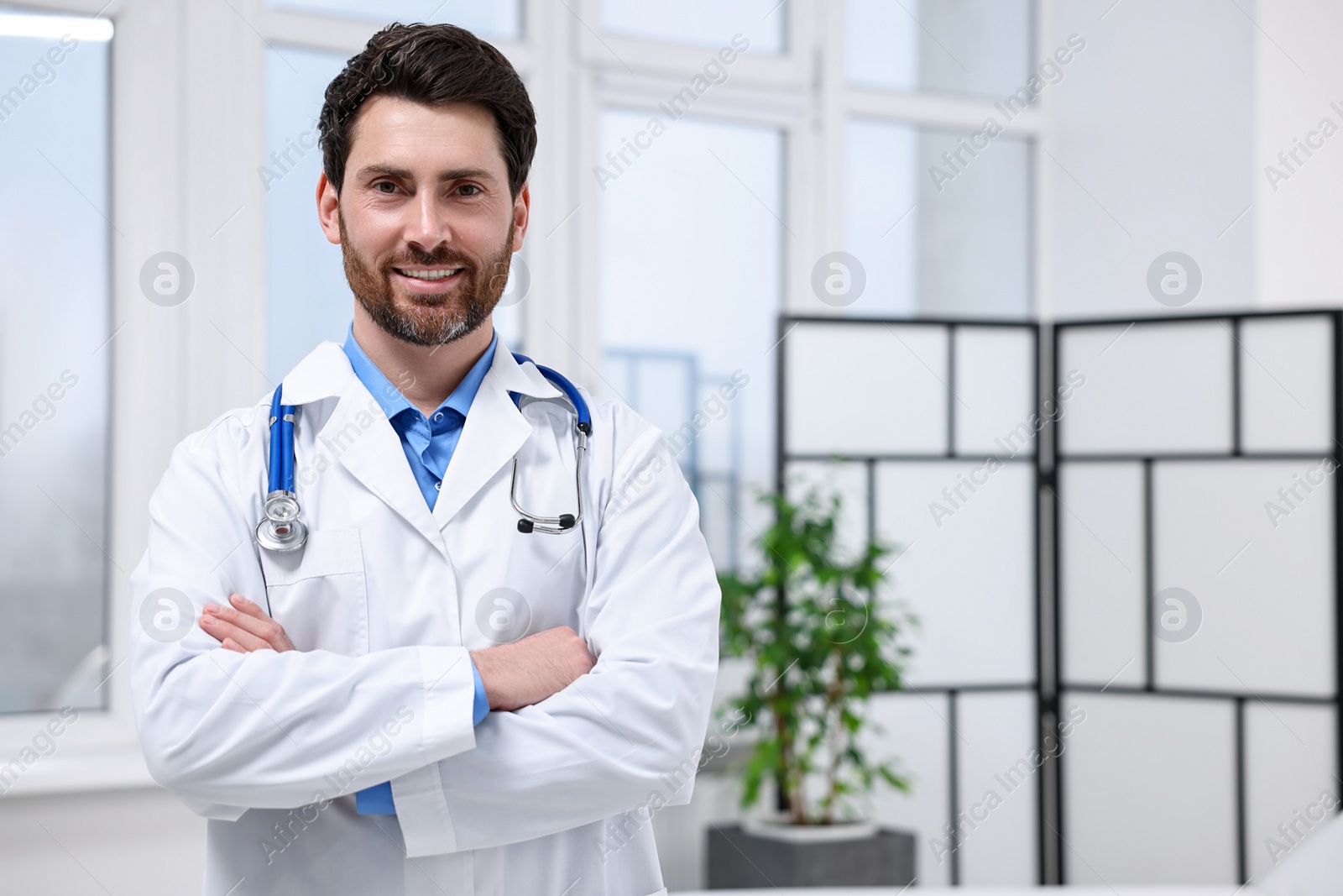 Photo of Medical consultant with stethoscope in clinic, space for text