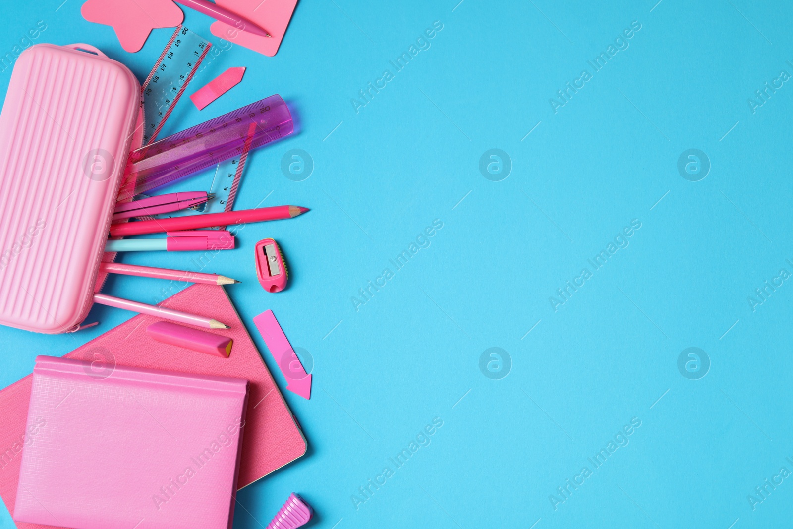 Photo of Different stationery on light blue background, flat lay with space for text. Back to school