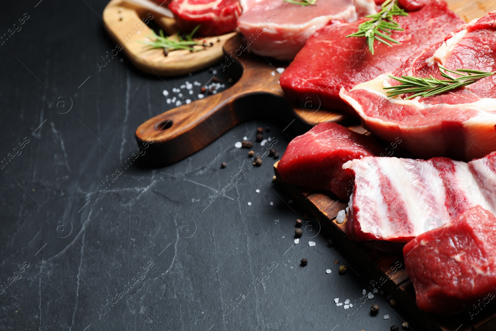 Photo of Composition with fresh raw meat on grey table, closeup