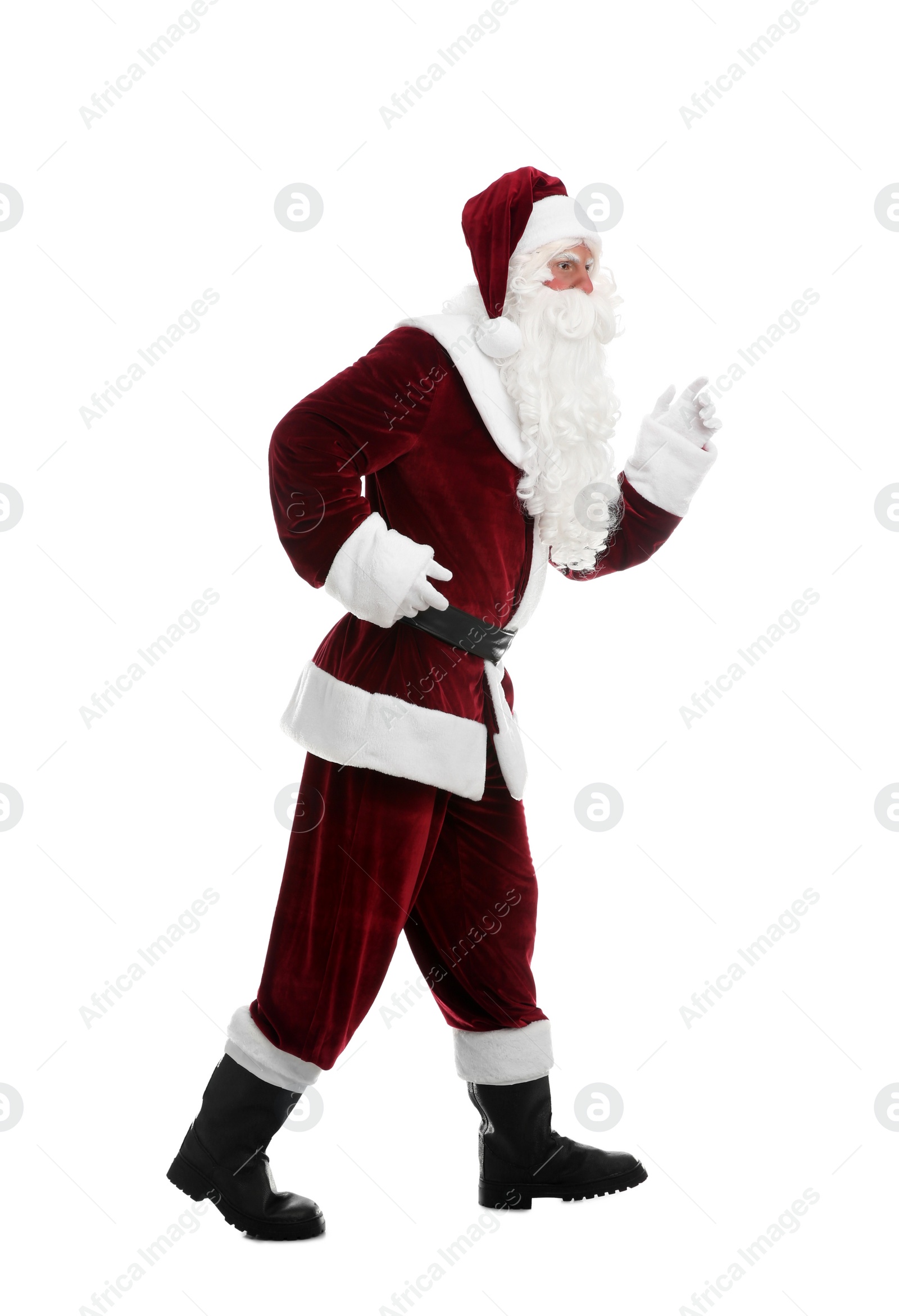 Photo of Full length portrait of Santa Claus walking on white background