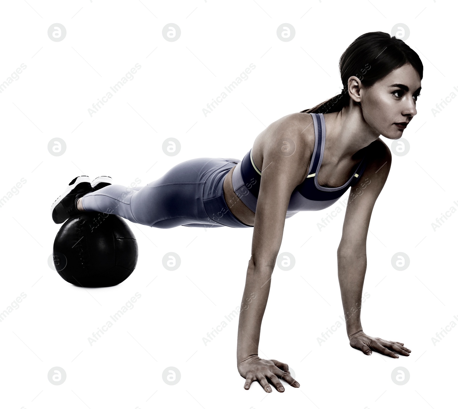 Image of Athletic woman doing exercise with medicine ball isolated on white