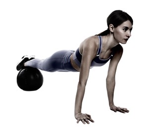 Image of Athletic woman doing exercise with medicine ball isolated on white