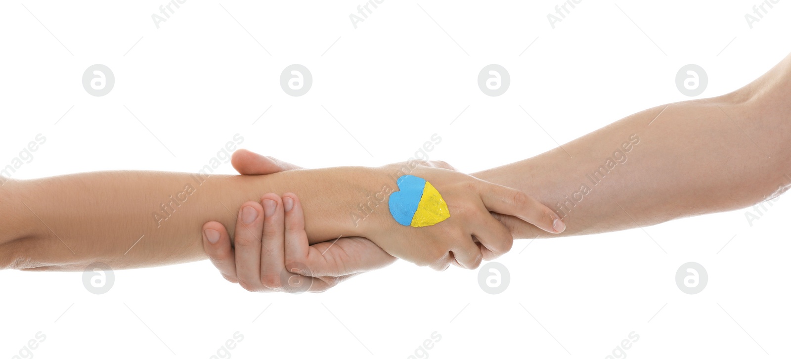 Photo of Man and woman with painted heart in colors of Ukrainian flag on her hand against white background, closeup