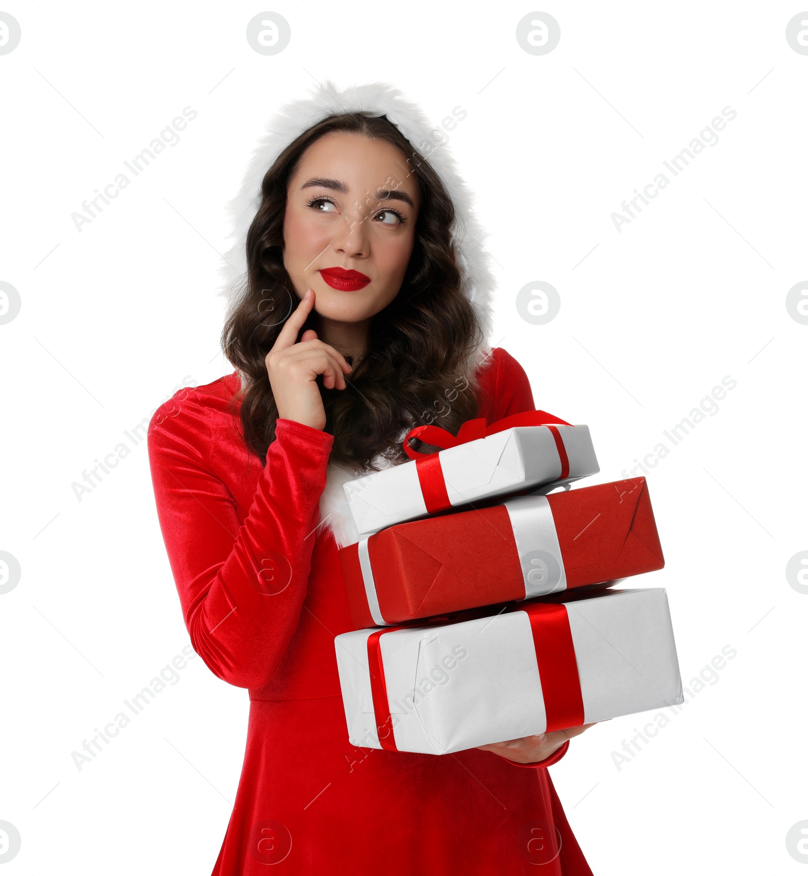 Photo of Beautiful young woman in Christmas red dress holding gift boxes isolated on white