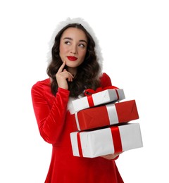 Photo of Beautiful young woman in Christmas red dress holding gift boxes isolated on white