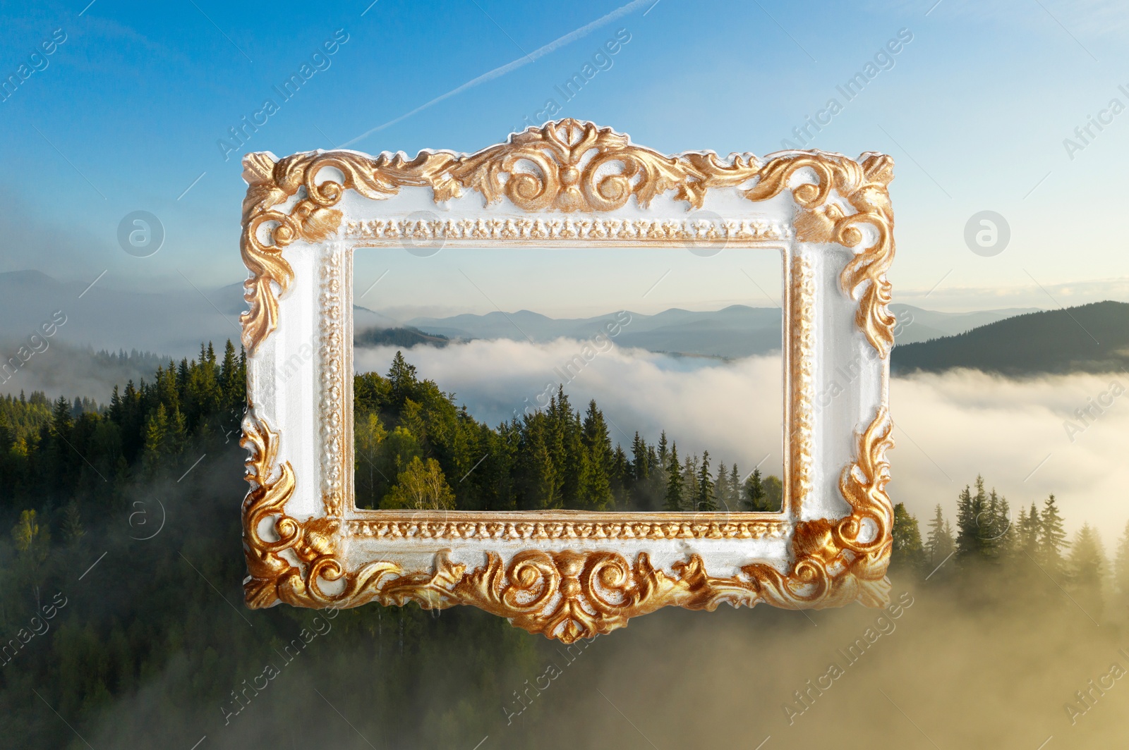 Image of Vintage frame and beautiful mountains covered with fog in morning