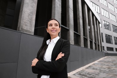 Photo of Portrait of smiling woman outdoors. Lawyer, businesswoman, accountant or manager