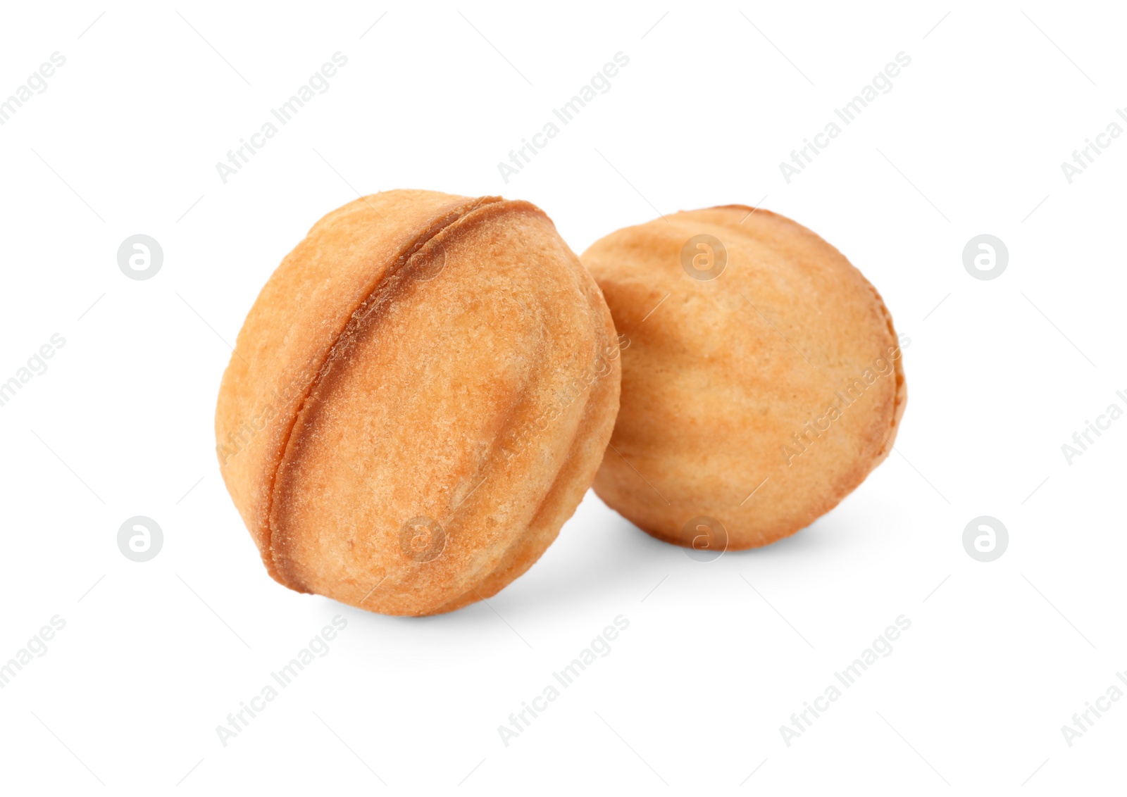 Photo of Delicious nut shaped cookies with condensed milk on white background