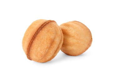 Photo of Delicious nut shaped cookies with condensed milk on white background