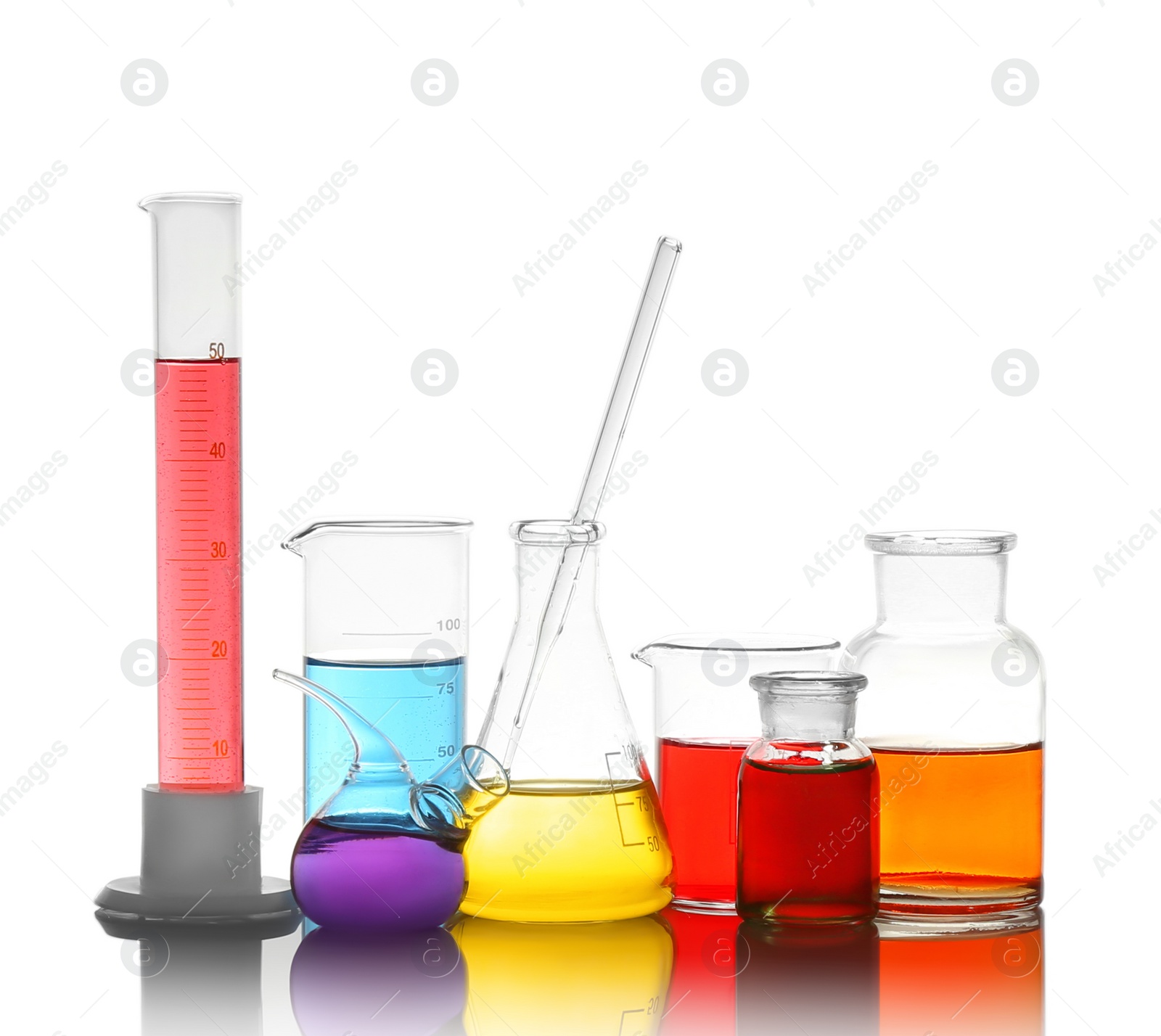 Photo of Different laboratory glassware with colorful liquids isolated on white
