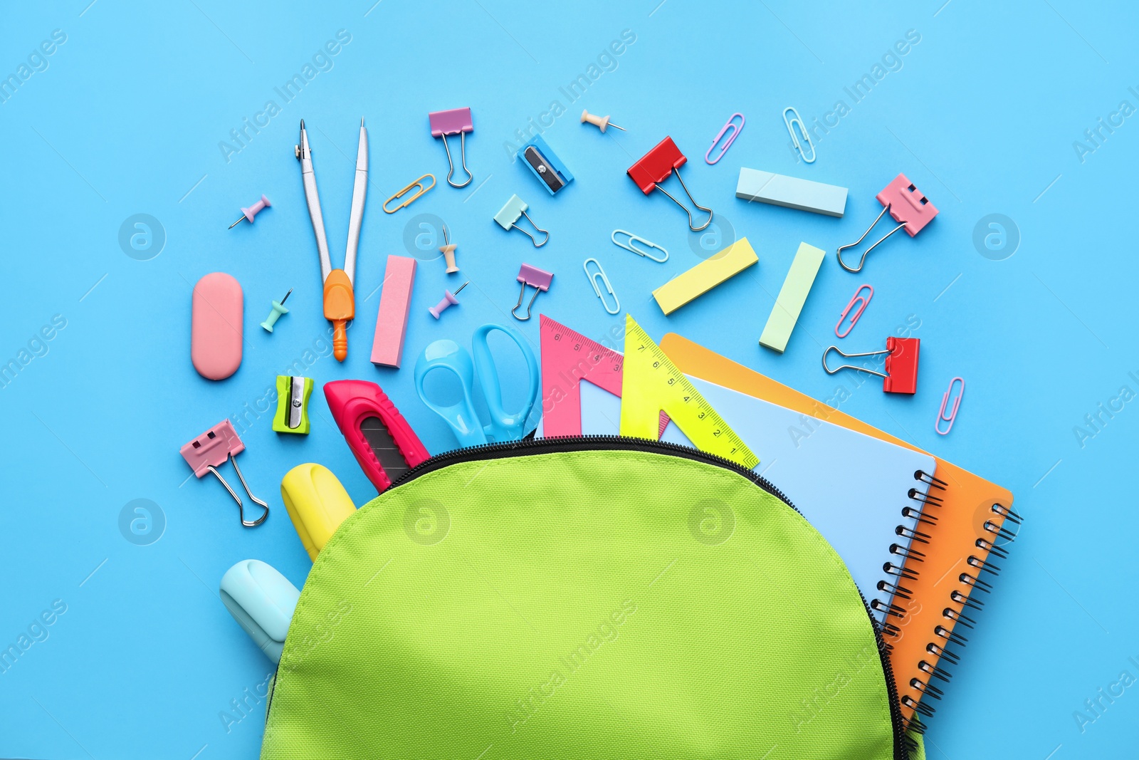 Photo of Back to school. Many different school stationery on light blue background, flat lay