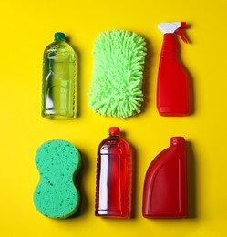 Photo of Different car products on yellow background, flat lay