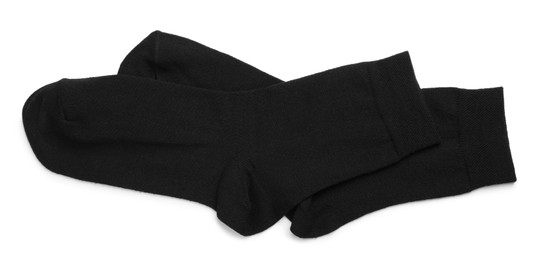 Pair of black socks on white background, top view