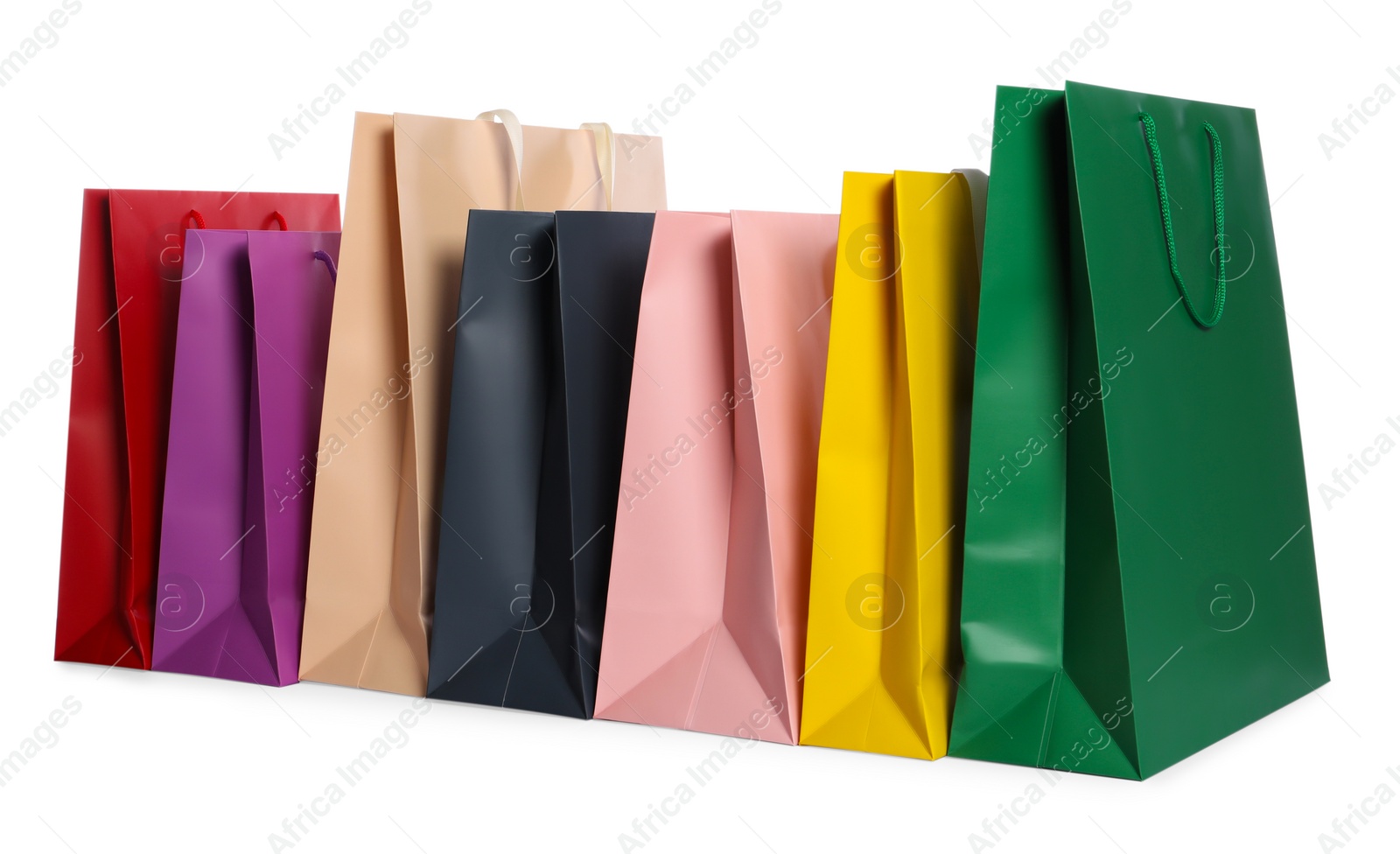 Photo of Colorful paper shopping bags isolated on white