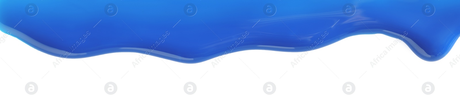 Photo of Blue nail polish flowing on white background