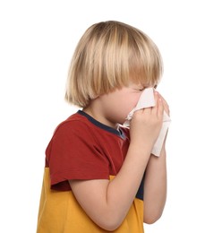 Photo of Boy blowing nose in tissue on white background, space for text. Cold symptoms