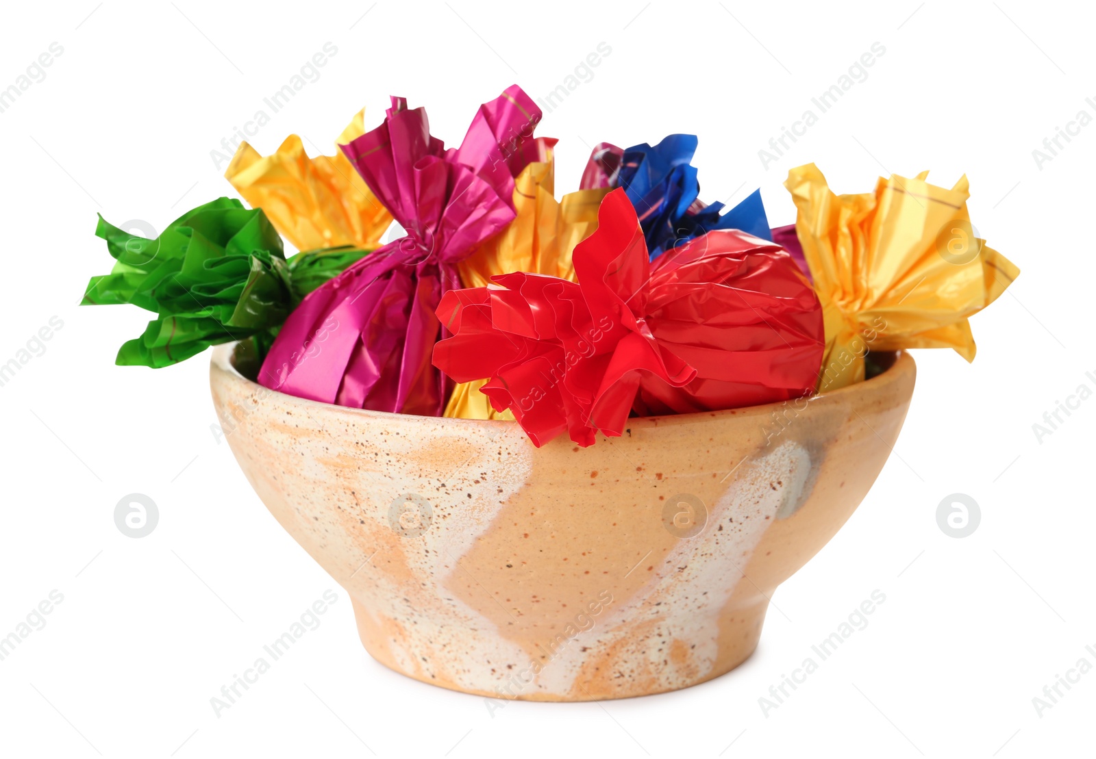 Photo of Bowl with candies in colorful wrappers isolated on white