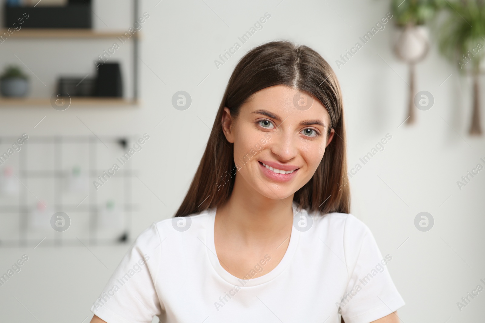 Photo of Happy woman having online video call at home, view from web camera