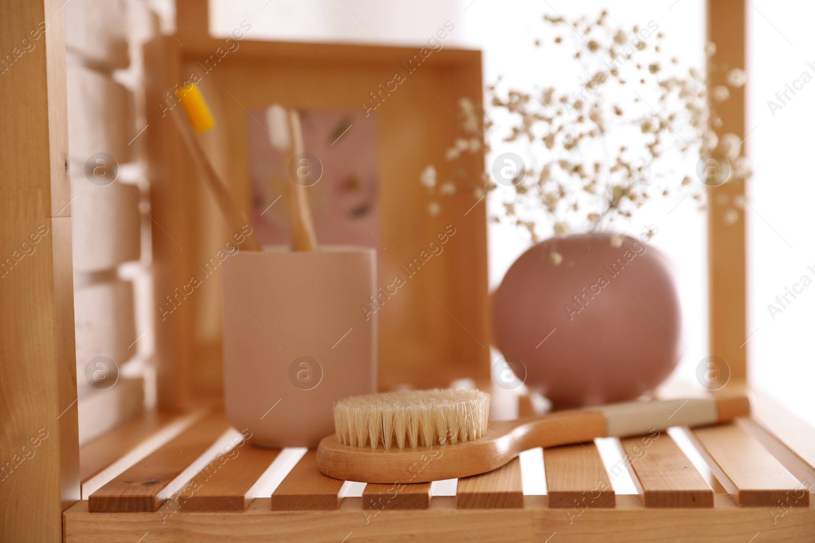 Photo of Shelving unit with toiletries indoors. Bathroom interior element