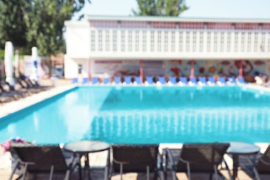 Blurred view of clean swimming pool on sunny day