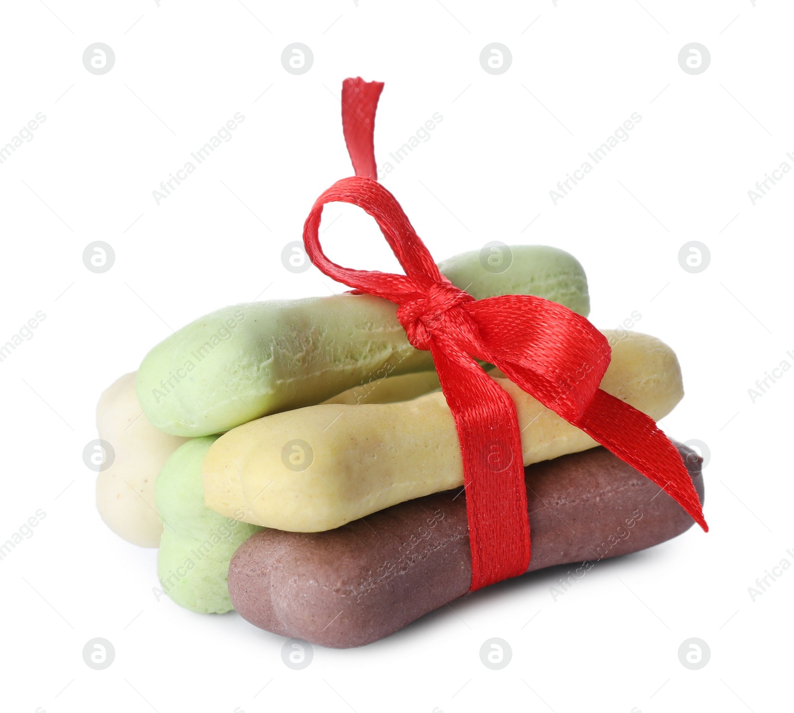 Photo of Different bone shaped dog cookies with red bow on white background