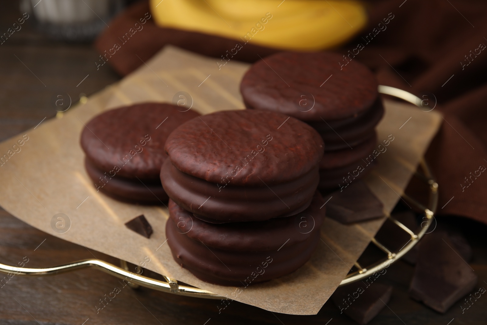 Photo of Delicious choco pies on wooden table, closeup