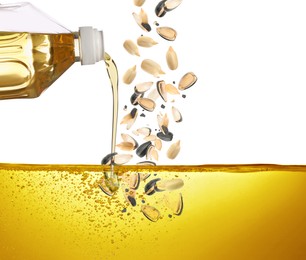 Image of Pouring sunflower oil and falling seeds on white background