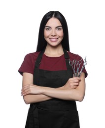 Photo of Portrait of happy hairdresser with professional scissors on white background