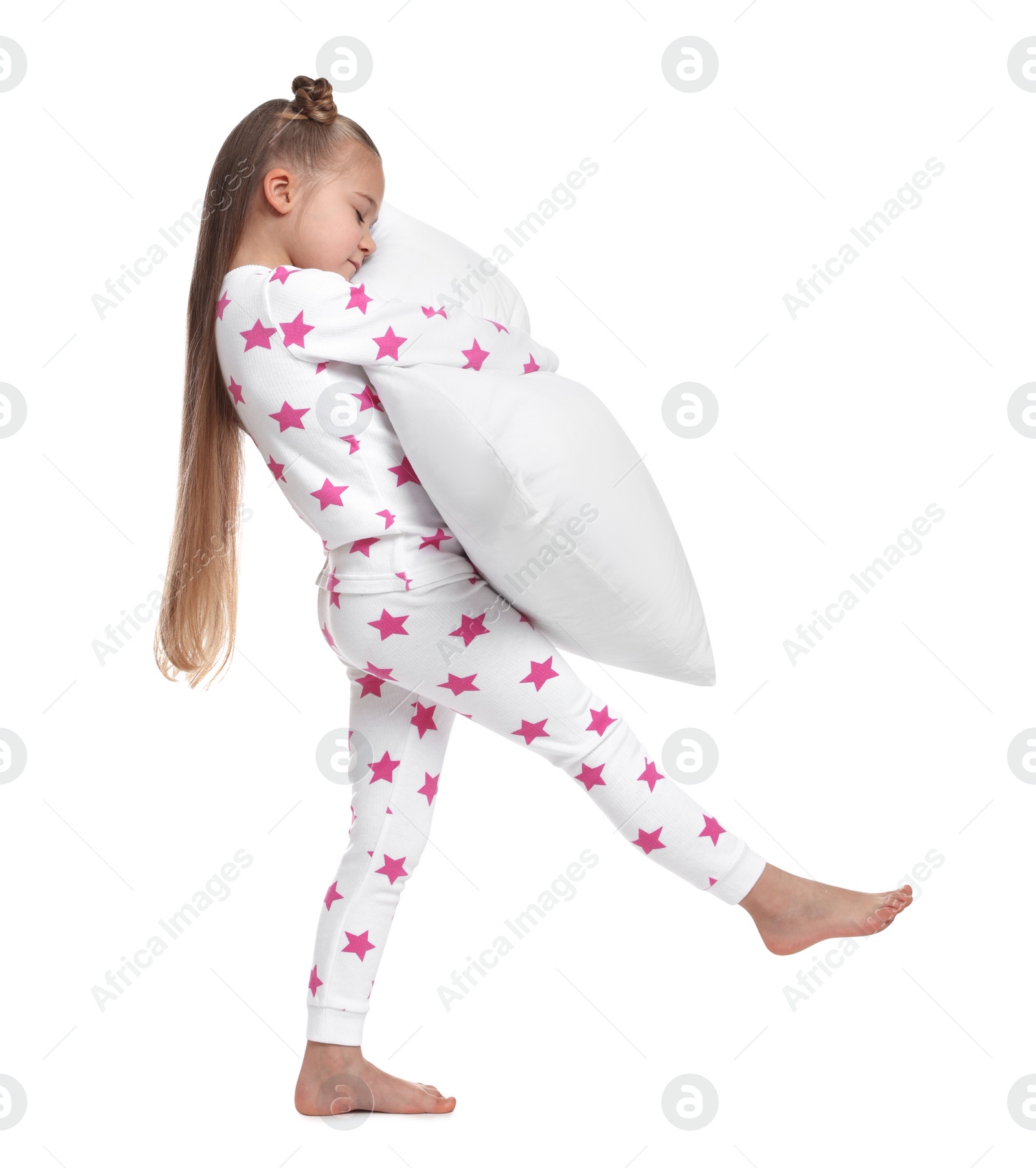 Photo of Girl in pajamas with pillow sleepwalking on white background