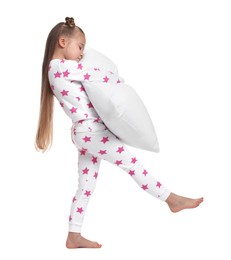 Girl in pajamas with pillow sleepwalking on white background