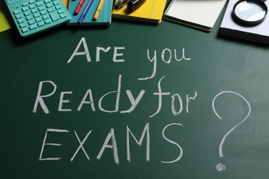 Photo of Green chalkboard with phrase Are You Ready For Exams and different stationery