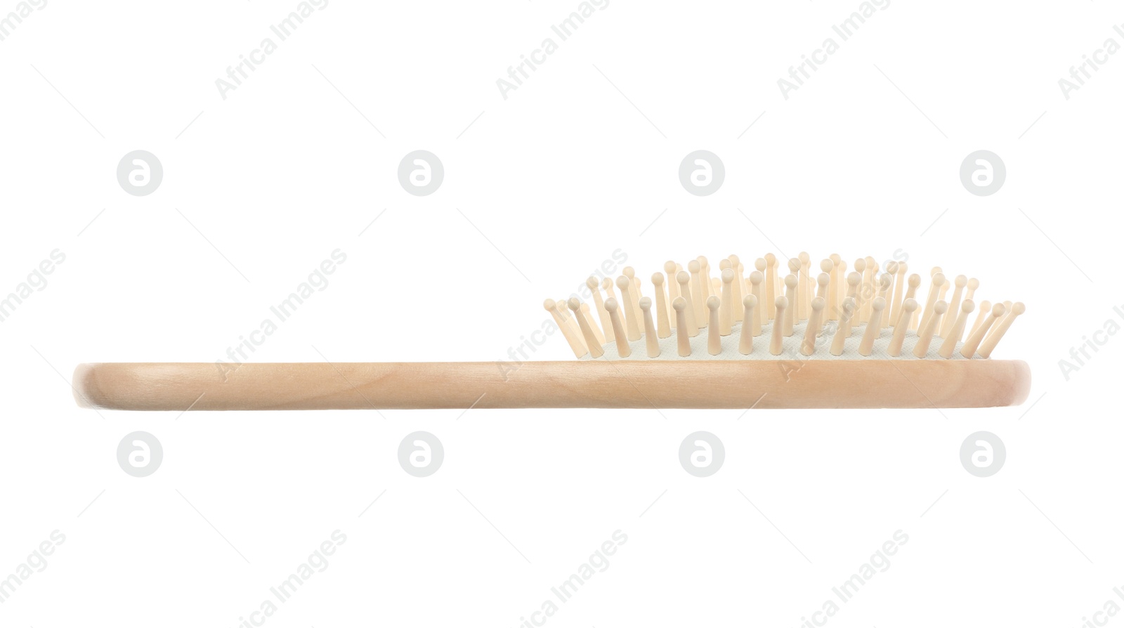 Photo of New wooden hair brush isolated on white