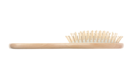 Photo of New wooden hair brush isolated on white