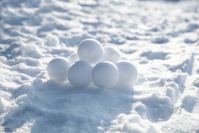 Photo of Pile of snowballs outdoors on sunny winter day