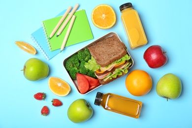 Flat lay composition with healthy food for school child on color background