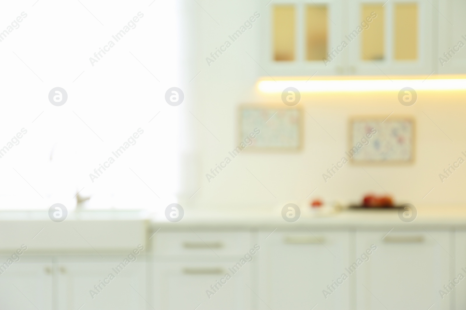 Photo of Blurred view of modern kitchen interior with stylish furniture