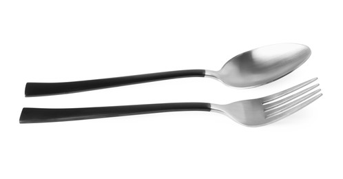 Photo of New fork and spoon with black handles on white background