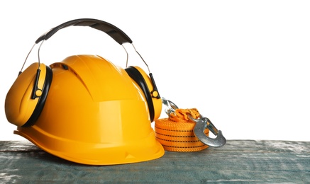 Photo of Set of safety equipment on table against white background