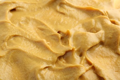 Photo of Fresh tasty mustard sauce as background, closeup