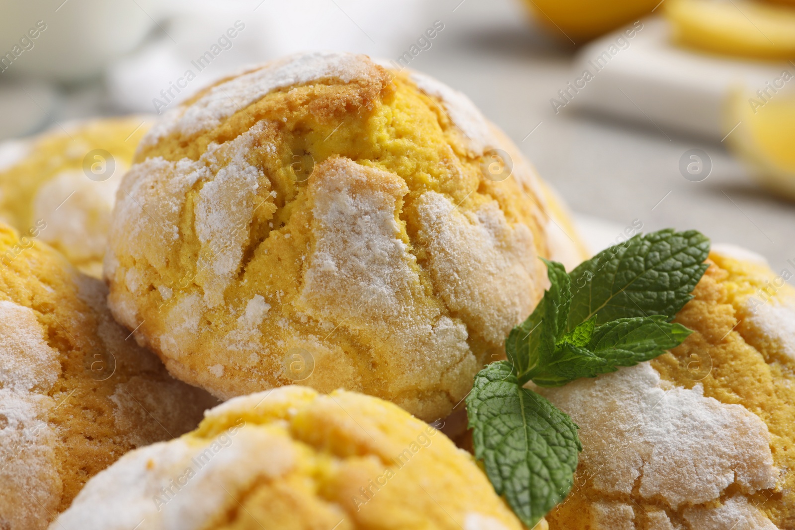 Photo of Fresh delicious lemon cookies and mint, closeup