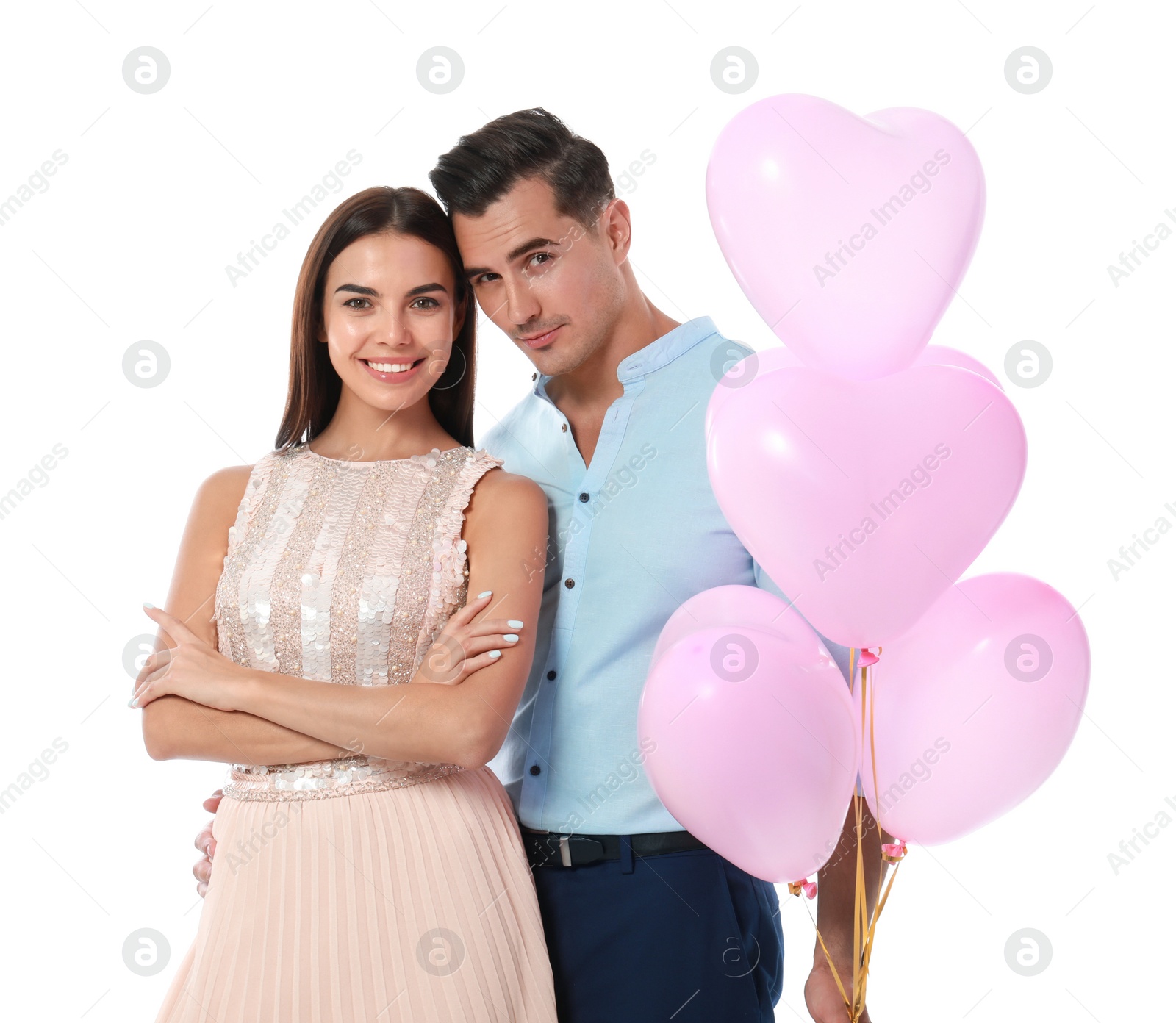 Photo of Beautiful couple with heart shaped balloons on white background