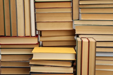 Photo of Many hardcover books as background. Library material