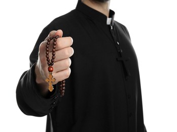 Photo of Priest with rosary beads on white background, closeup